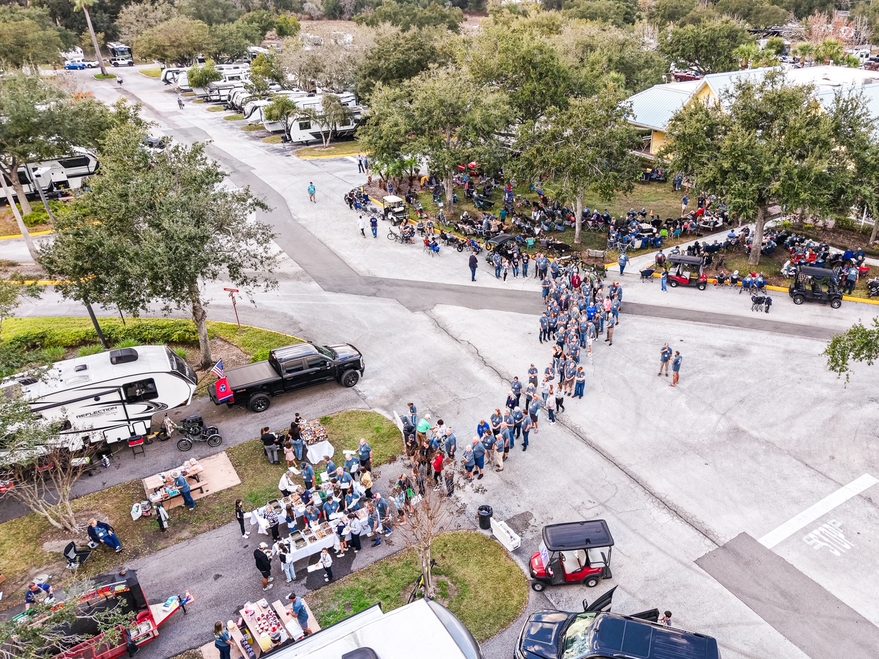 Aerial view of campout attendees lined up for a meal at Lazydays RV Resort